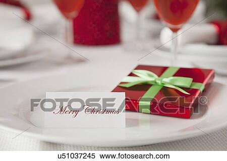 Stock Photography - USA, Illinois, Metamora, Plate with small gift and greeting card. Fotosearch