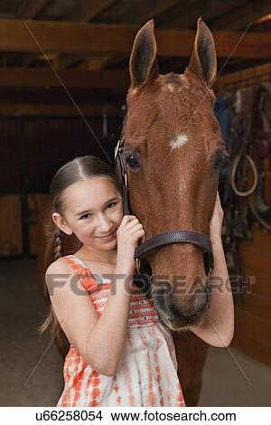 Picture - USA, Illinois, Metamora, Portrait of girl (10-11) with horse. Fotosearch
