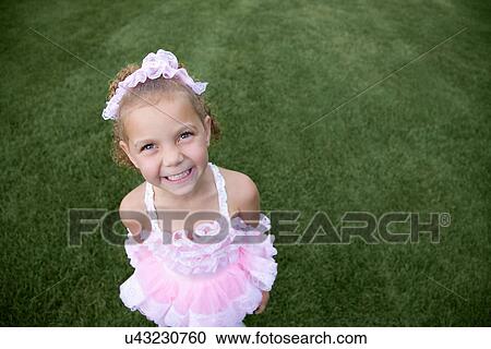 Stock Image - USA, Illinois, Metamora, Portrait of girl (6-7) in Hallloween costume. Fotosearch
