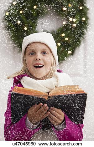 USA, Illinois, Metamora, Portrait of girl (6-7) singing carols View Large Photo Image Stock Image - USA, Illinois, Metamora, Portrait of girl (6-7) singing carols. Fotosearch