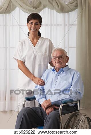 USA, Illinois, Metamora, Portrait of female nurse with senior man on wheelchair View Large Photo Image Stock Image - USA, Illinois, Metamora, Portrait of female nurse with senior man on wheelchair. Fotosearch