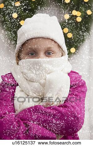 USA, Illinois, Metamora, Portrait of girl (6-7) standing in front of christmas wreath View Large Photo Image Stock Photo - USA, Illinois, Metamora, Portrait of girl (6-7) standing in front of christmas wreath. Fotosearch