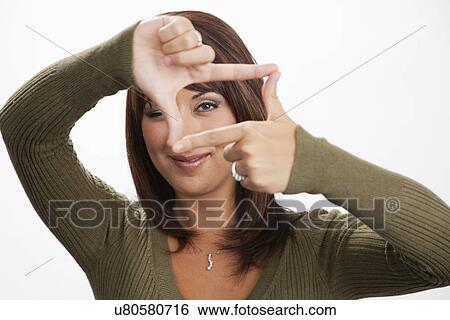 USA, Illinois, Metamora, Portrait of woman making finger frame View Large Photo Image Stock Photograph - USA, Illinois, Metamora, Portrait of woman making finger frame. Fotosearch