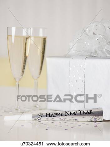 USA, Illinois, Metamora, Present, champagne flutes and party blower View Large Photo Image Stock Image - USA, Illinois, Metamora, Present, champagne flutes and party blower. Fotosearch