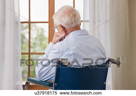 USA, Illinois, Metamora, Rear view of senior man on wheelchair resting in front of window View Large Photo Image Stock Photography - USA, Illinois, Metamora, Rear view of senior man on wheelchair resting in front of window. Fotosearch