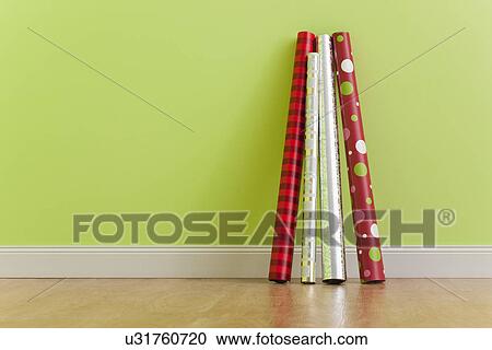 USA, Illinois, Metamora, Rolled up wrapping papers leaning against green wall View Large Photo Image Stock Image - USA, Illinois, Metamora, Rolled up wrapping papers leaning against green wall. Fotosearch
