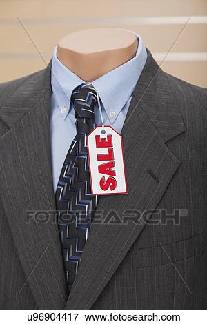 USA, Illinois, Metamora, Sale tag on suit in shop View Large Photo Image Stock Photo - USA, Illinois, Metamora, Sale tag on suit in shop. Fotosearch