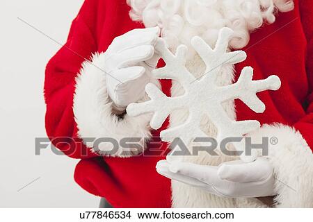 USA, Illinois, Metamora, Santa claus holding large clock View Large Photo Image Picture - USA, Illinois, Metamora, Santa claus holding large clock. Fotosearch