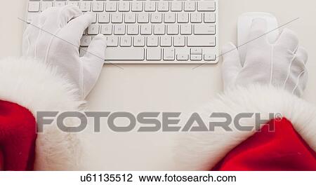 USA, Illinois, Metamora, Santa claus typing on keyboard View Large Photo Image Stock Image - USA, Illinois, Metamora, Santa claus typing on keyboard. Fotosearch