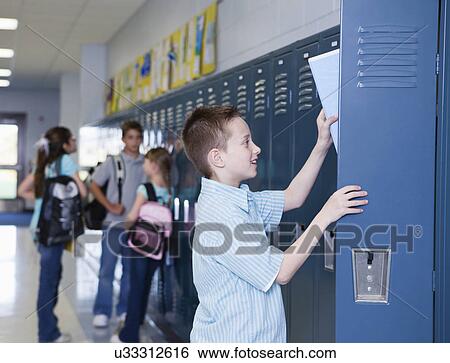 USA, Illinois, Metamora, Schoolchildren (8-9, 10-11) at lockers in school corridor View Large Photo Image Stock Photograph - USA, Illinois, Metamora, Schoolchildren (8-9, 10-11) at lockers in school corridor. Fotosearch