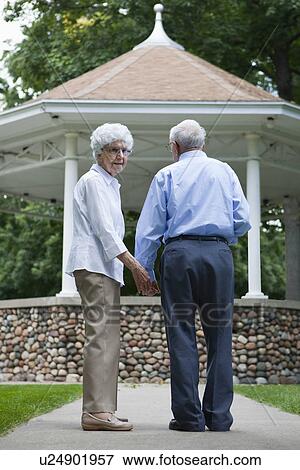 Stock Photo - USA, Illinois, Metamora, Senior couple in park. Fotosearch