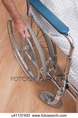 USA, Illinois, Metamora, Senior man sitting on wheelchair, mid section View Large Photo Image Stock Image - USA, Illinois, Metamora, Senior man sitting on wheelchair, mid section. Fotosearch