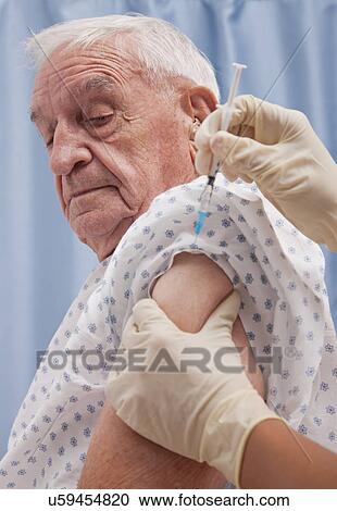 USA, Illinois, Metamora, Senior man receiving injection View Large Photo Image Stock Image - USA, Illinois, Metamora, Senior man receiving injection. Fotosearch