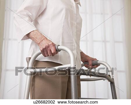 USA, Illinois, Metamora, Senior woman walking with walker, mid section View Large Photo Image Stock Image - USA, Illinois, Metamora, Senior woman walking with walker, mid section. Fotosearch