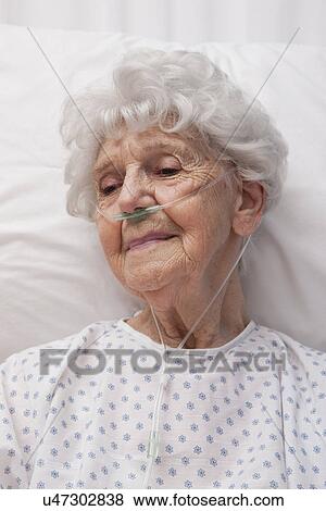 USA, Illinois, Metamora, Senior woman wearing oxygen tubes View Large Photo Image Stock Photo - USA, Illinois, Metamora, Senior woman wearing oxygen tubes. Fotosearch