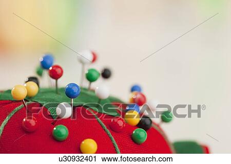 Stock Image - USA, Illinois, Metamora, sewing pins in cushion. Fotosearch