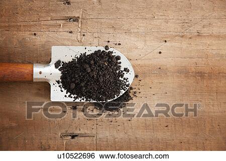 USA, Illinois, Metamora, Shovel with dirt, directly above View Large Photo Image Stock Photograph - USA, Illinois, Metamora, Shovel with dirt, directly above. Fotosearch