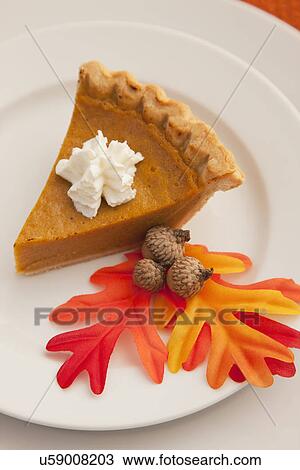 Stock Image - USA, Illinois, Metamora, Slice of pumpkin pie. Fotosearch