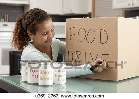 USA, Illinois, Metamora, Smiling girl (10-11) preparing food drive in kitchen View Large Photo Image Stock Image - USA, Illinois, Metamora, Smiling girl (10-11) preparing food drive in kitchen. Fotosearch