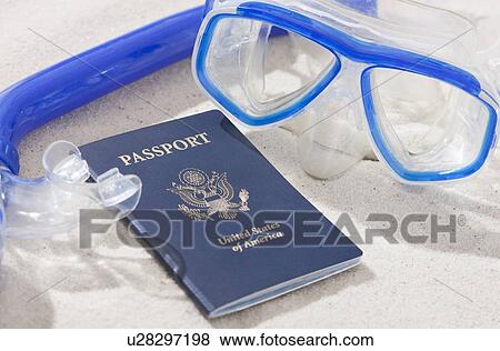 Stock Photo - USA, Illinois, Metamora, Snorkel and passport on beach. Fotosearch