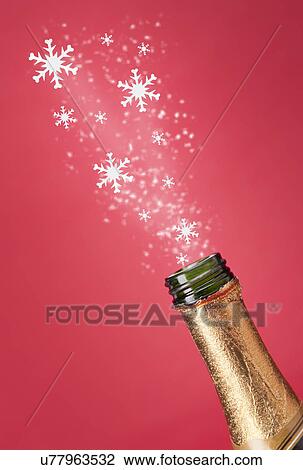 USA, Illinois, Metamora, Snowflakes flying from champagne bottle View Large Photo Image Stock Image - USA, Illinois, Metamora, Snowflakes flying from champagne bottle. Fotosearch