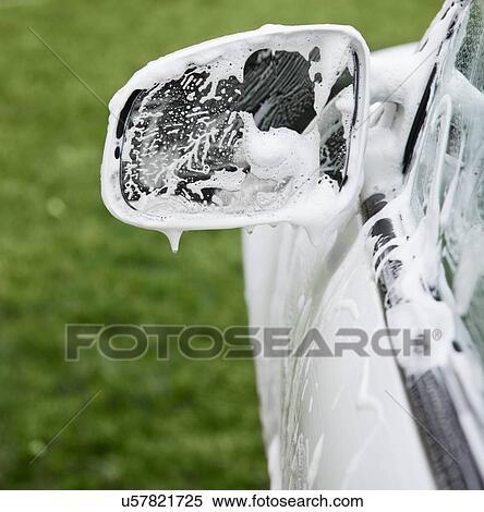 Stock Photography - USA, Illinois, Metamora, Soap sud on rearview mirror. Fotosearch