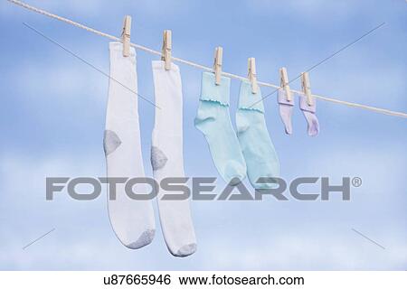 USA, Illinois, Metamora, socks in various sizes drying on clothesline View Large Photo Image Stock Photograph - USA, Illinois, Metamora, socks in various sizes drying on clothesline. Fotosearch