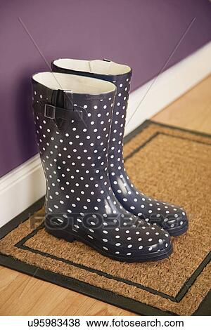 Stock Photo - USA, Illinois, Metamora, Spotted rubber boots, high angle view. Fotosearch