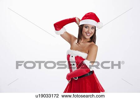 USA, Illinois, Metamora, Studio shot of woman wearing Santa costume View Large Photo Image Stock Image - USA, Illinois, Metamora, Studio shot of woman wearing Santa costume. Fotosearch