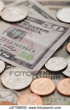 USA, Illinois, Metamora, Studio shot of American banknotes and coins View Large Photo Image Stock Image - USA, Illinois, Metamora, Studio shot of American banknotes and coins. Fotosearch