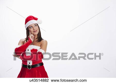 USA, Illinois, Metamora, Studio shot of woman wearing Santa costume View Large Photo Image Stock Image - USA, Illinois, Metamora, Studio shot of woman wearing Santa costume. Fotosearch