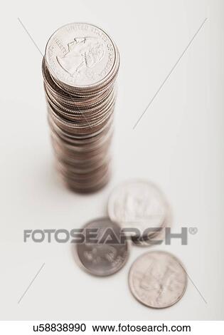 Stock Image - USA, Illinois, Metamora, Studio shot of stack of coins. Fotosearch