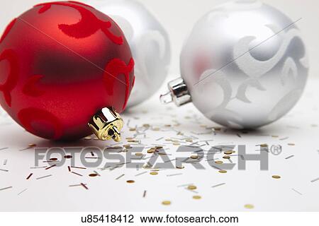 Stock Image - USA, Illinois, Metamora, Studio shot of Christmas ornaments. Fotosearch
