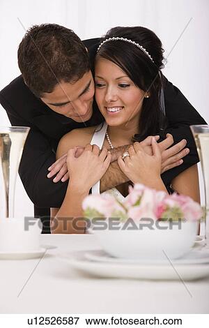 Stock Photo - USA, Illinois, Metamora, Studio shot of bride and groom. Fotosearch