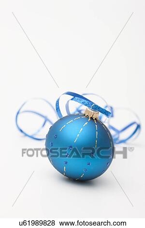 USA, Illinois, Metamora, Studio shot of single blue Christmas bauble View Large Photo Image Stock Photo - USA, Illinois, Metamora, Studio shot of single blue Christmas bauble. Fotosearch