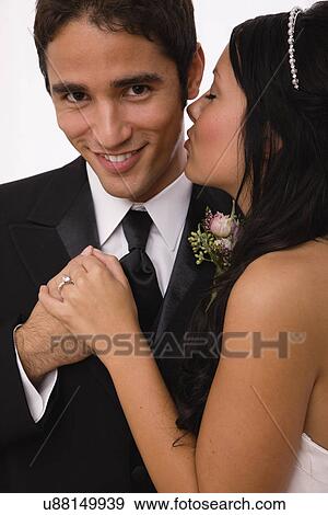 Stock Photo - USA, Illinois, Metamora, Studio shot of bride and groom. Fotosearch