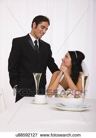 Stock Photo - USA, Illinois, Metamora, Studio shot of bride and groom. Fotosearch