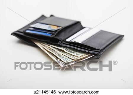 USA, Illinois, Metamora, Studio shot of wallet with American banknotes View Large Photo Image Stock Photograph - USA, Illinois, Metamora, Studio shot of wallet with American banknotes. Fotosearch