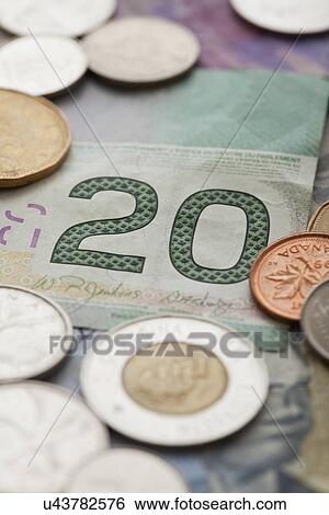 Stock Photograph - USA, Illinois, Metamora, Studio shot of Canadian banknotes and coins. Fotosearch