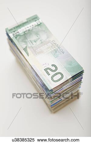 Stock Photography - USA, Illinois, Metamora, Studio shot of stack of Canadian banknotes. Fotosearch