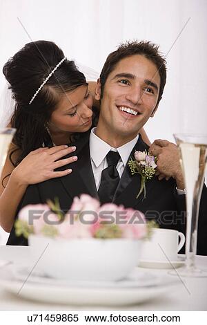 USA, Illinois, Metamora, Studio shot of bride and groom View Large Photo Image Stock Photography - USA, Illinois, Metamora, Studio shot of bride and groom. Fotosearch
