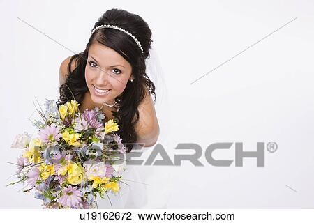 USA, Illinois, Metamora, Studio portrait of young bride View Large Photo Image Stock Image - USA, Illinois, Metamora, Studio portrait of young bride. Fotosearch