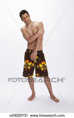 USA, Illinois, Metamora, Studio portrait of man in shorts View Large Photo Image Stock Image - USA, Illinois, Metamora, Studio portrait of man in shorts. Fotosearch