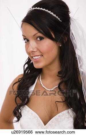 Stock Photograph - USA, Illinois, Metamora, Studio portrait of bride. Fotosearch