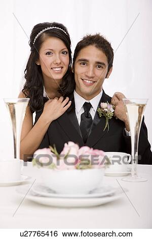 Stock Photograph - USA, Illinois, Metamora, Studio portrait of bride and groom. Fotosearch