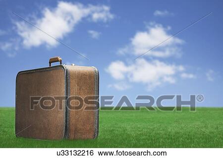 USA, Illinois, Metamora, Suitcase in meadow View Large Photo Image Stock Photograph - USA, Illinois, Metamora, Suitcase in meadow. Fotosearch