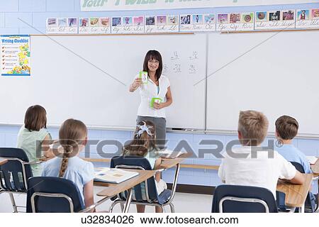 USA, Illinois, Metamora, Teacher and students (8-9) in classroom View Large Photo Image Stock Photograph - USA, Illinois, Metamora, Teacher and students (8-9) in classroom. Fotosearch