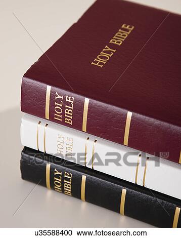 Stock Image - USA, Illinois, Metamora, Three bibles stacked. Fotosearch