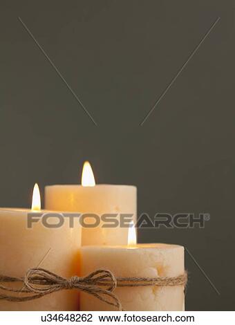 Stock Image - USA, Illinois, Metamora, Three candles. Fotosearch