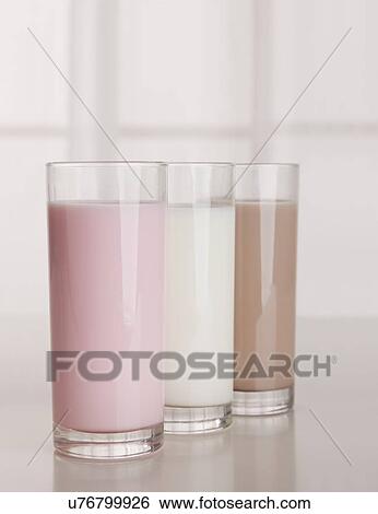 Stock Photograph - USA, Illinois, Metamora, Three flavored milks in glasses. Fotosearch